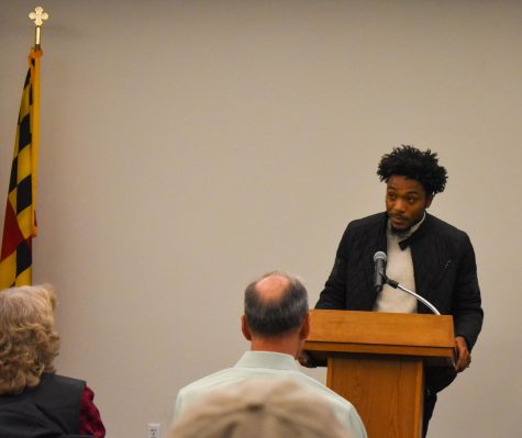 Third-year psychology student Tevin Paige speaks at a ceremony honoring veterans at AACC.