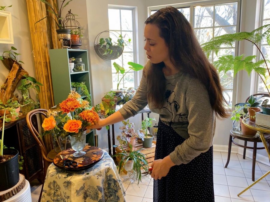 Second-year entrepreneurial studies student Sara Gray-Foreman arranges flowers for weddings. 