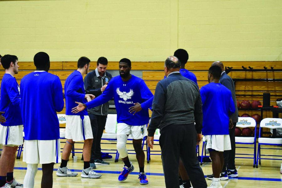 Mens Basketball forward Davon Jones runs out as the line-up is announced.