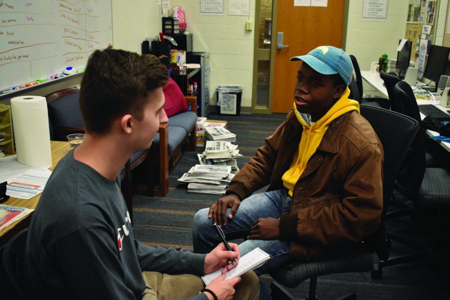 First-year communications student Jacob Hudson (left) interviews second-year journalism student and new Campus Current Editor-in-Chief Christian Richey.