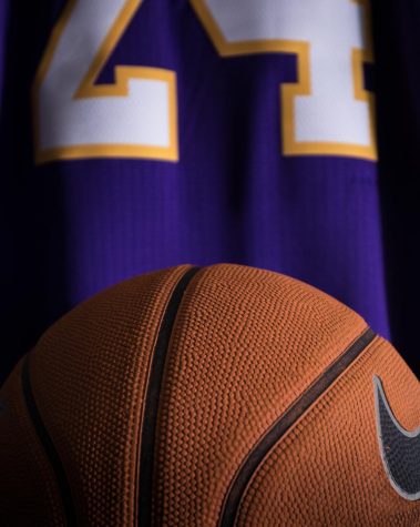 Bryant's jersey behind a basketball. 