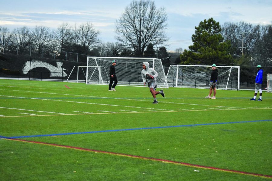 Baseball center fielder Jaden Jones works on fielding at practice.