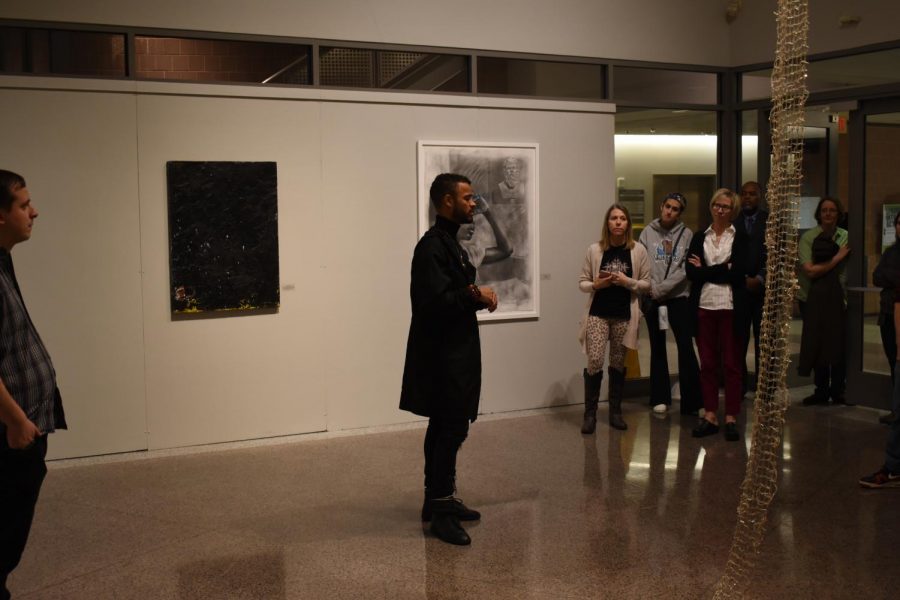 Curator Thomas James speaks to an audience of students and faculty about the art exhibit Grey Matter: A Response to Blackness, held in the Cade Gallery.