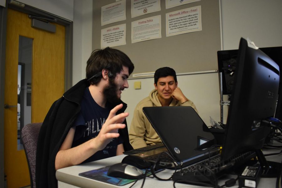 Computer Science Club members Jeremy Snyder, a second-year computer science student (left), and Vincent Aurigemma, a first-year computer science student work on a project during the club meeting. 