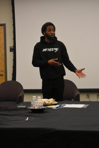 Speaker Timone Brown tells his life story during Black Male Summit.