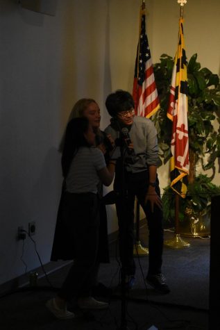 Ryan Kim (right) performs Karaoke with SGA members.