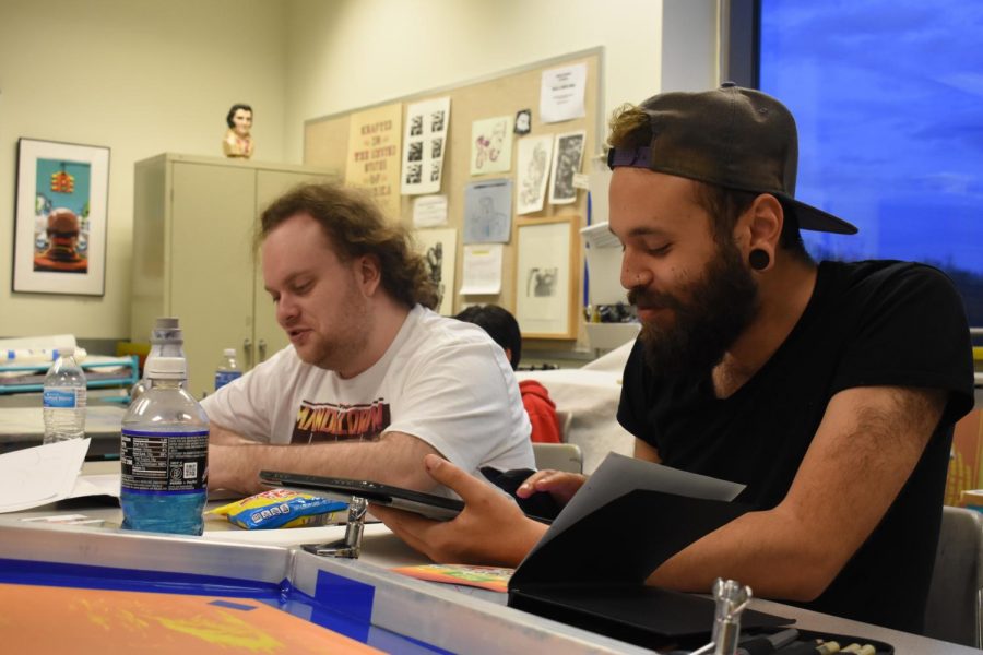 Art Association Vice President Vinni Quagliato (right) and second-year transfer studies student Zev Berman work on projects 