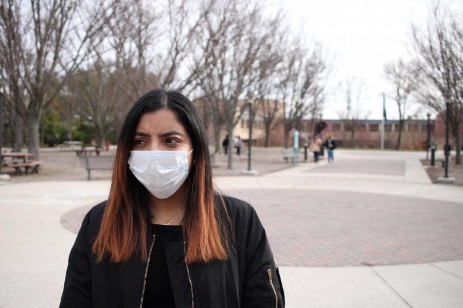 Lindsey Gonzalez, a third-year transfer studies student, wears a surgical on the quad to protect from the coronavirus.