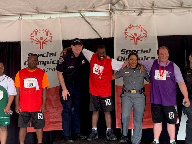 Special Police Sgt. Stephen Shepet (center) is one of nine AACC faculty and employees to win a League of Innovation Excellence award.