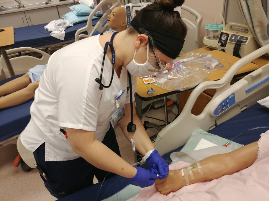 Third-year nursing student Natasha Seeger practices her skills on the Arnold campus.