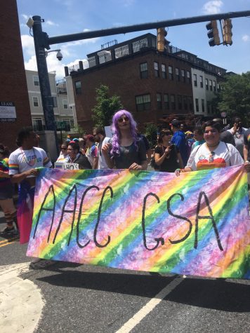 Coming Out Week and Black Male Initiative coordinators win the annual Equity and Inclusion Champion Award. Featured: Student and faculty marches in Annapolis’s first-ever Pride Parade in June 2019.