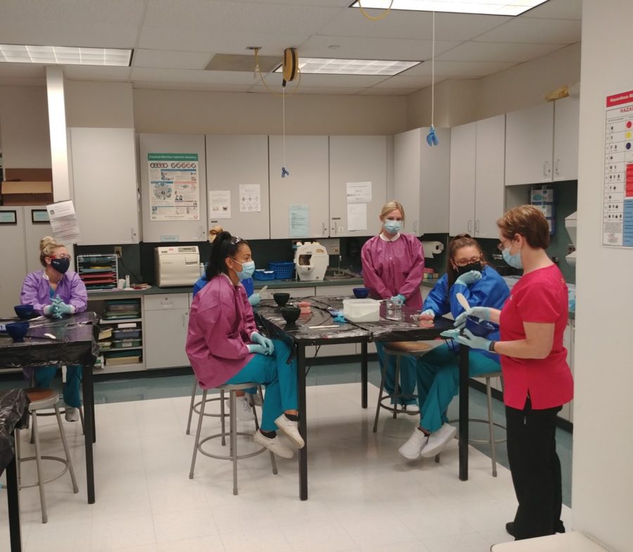 Approximately 180 classes will have limited number of face-to-face sections on campus next semester. Featured: Dental students in a face-to face class on the Arnold campus in the fall semester.