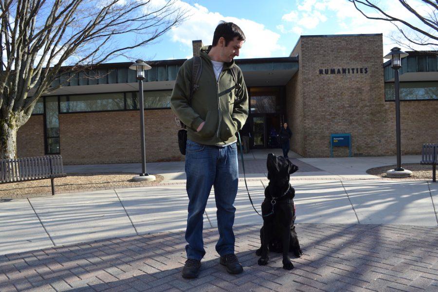 Service+animal+experts+encourage+students+to+volunteer+to+raise+service+animals+for+veterans.+Shown%2C+former+journalism+student+Michael+Garvey%2C+a+veteran%2C+and+his+service+dog+Liberty%2C+on+campus+in+2017.