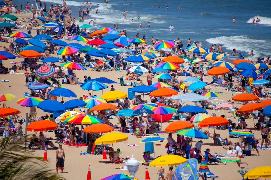 A campus nurse advices students to use high-SPF sunscreen and skip alcoholic drinks while in the sun. Shown, Ocean City, Maryland, pre-pandemic.