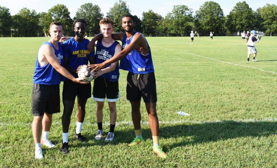 Riverhawks men’s soccer midfielder
Armin Lugonjic (far left) and forwards Charles Warari, John Kenny and Silas Baker pose on a practice field on campus.

