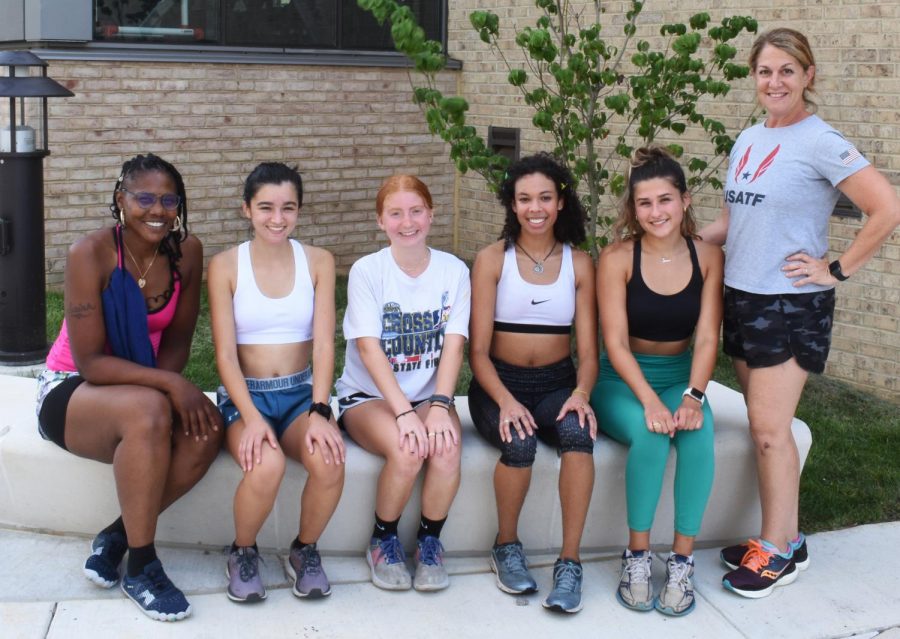 Riverhawks women’s cross country runners (left to right) Jasmine Mauldin, Holly Boggs, Madison Palmer, Jasmine Jones and Sierra Keen pose outside of the gym on the Arnold campus 
 with their head coach Susan Noble (far right). 