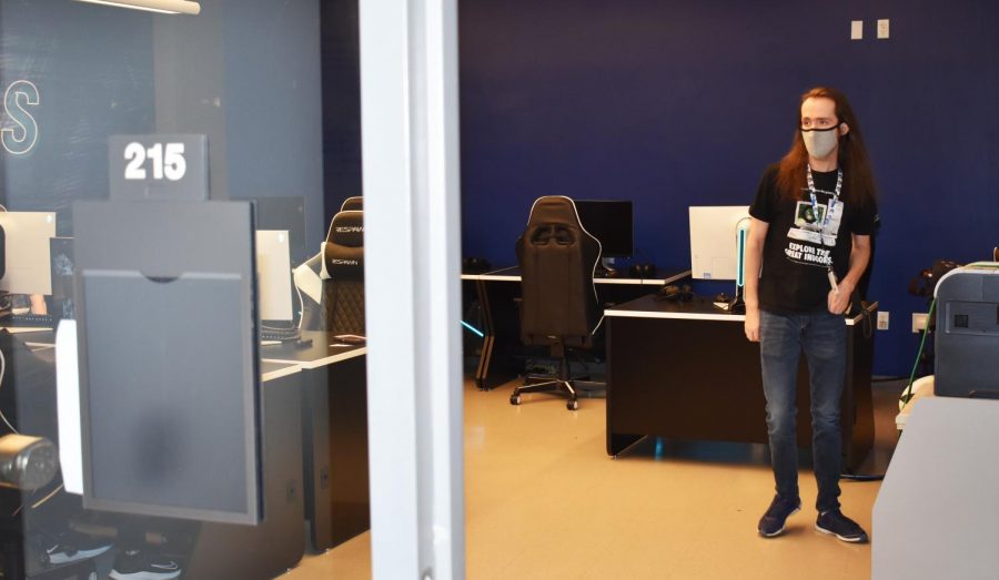 AACC alum Conway Johnson, who created the student ESports Club in 2014, is the new head coach of an athletic esports team set to start competing in the spring. Shown, Johnson checks out a new esports lab in CALT where the team will practice and compete.