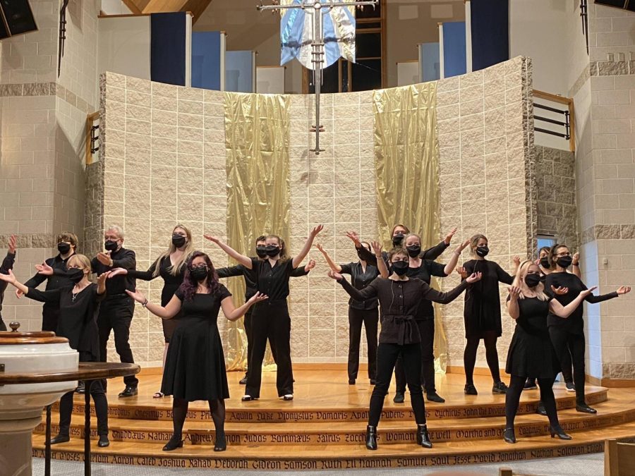 The chamber singers performing in all black.