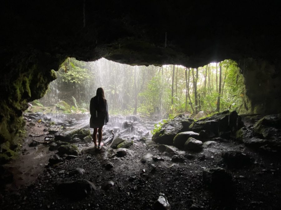A yonug woman, Lilly Roser, standing in a tropical Costa Rican cave.