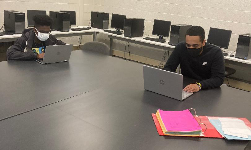 Journalism students DAngelo Williams (left) and Jerryt Haley study together after their face-to-face class on Tuesday.