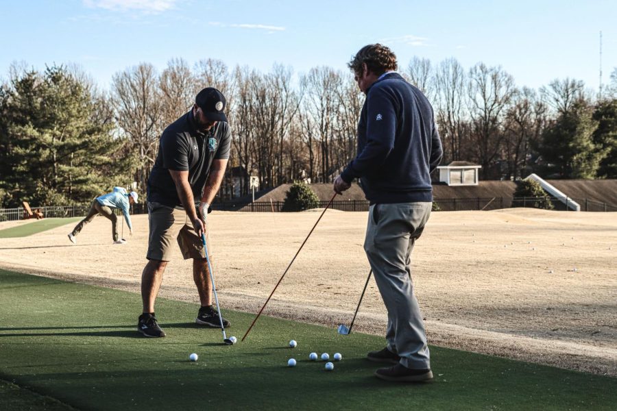 David Henderson (left) prepares for 2022 golf season.