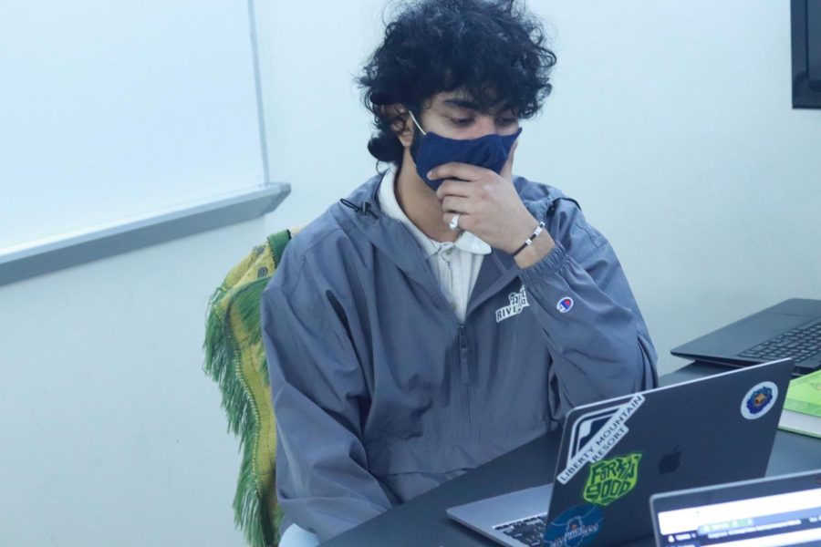 Second-year psychology student Hamza Iqbal at
-
tends a Zoom meeting for his online SYNC class.