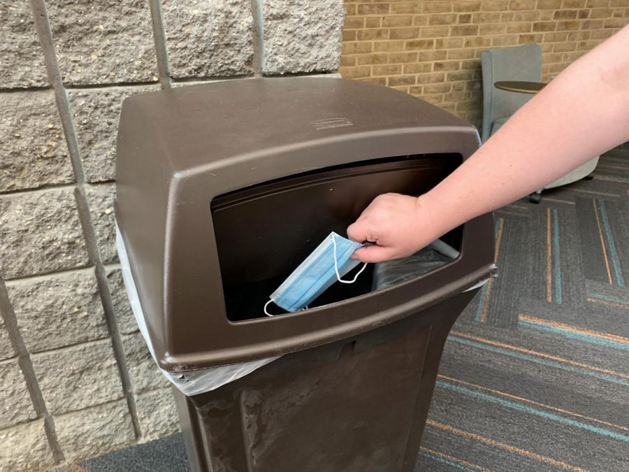 A mask being thrown away.