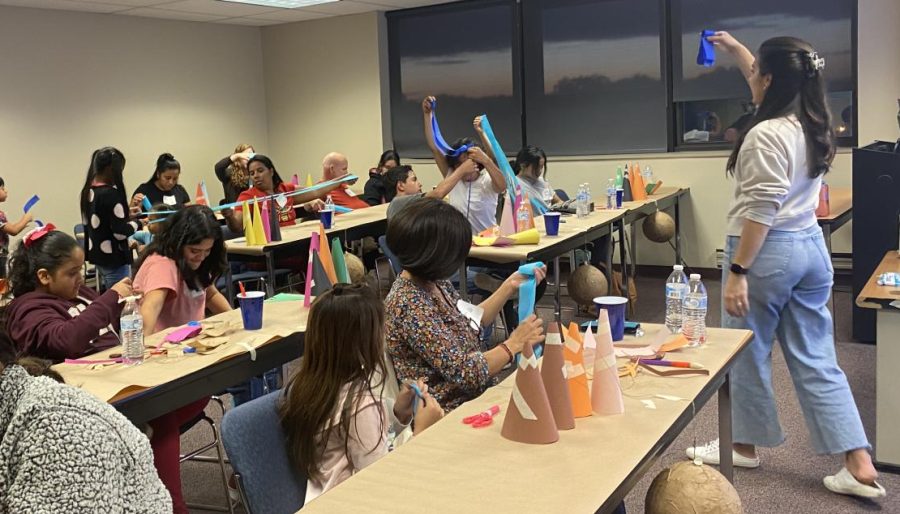 Students make pinatas from paper-mache at a Hispanic Heritage Month event.