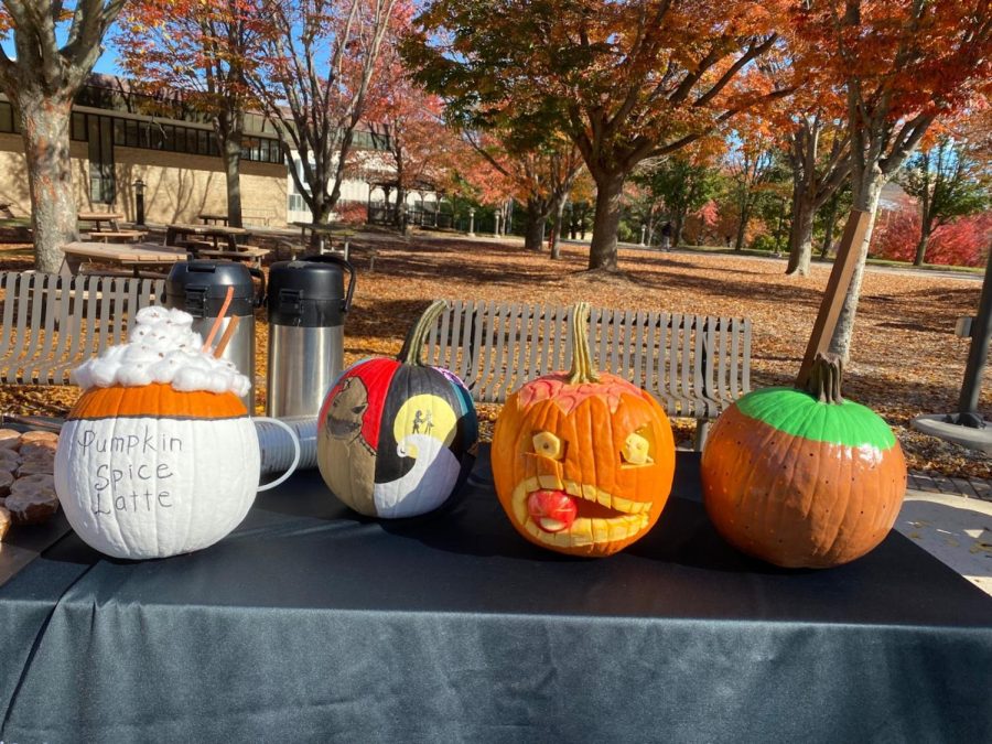 Four carved pumpkins.