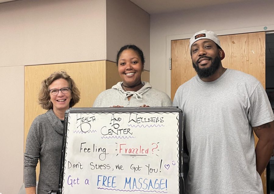From left to right, massage therapy Academic Chair Lynne Brummitt, smiles with first-year massage therapy student Jordyn Brown and first-year massage therapy student Gregory Dailey, who gave fellow students 10-minute massages as part of the Stress Less Festival.