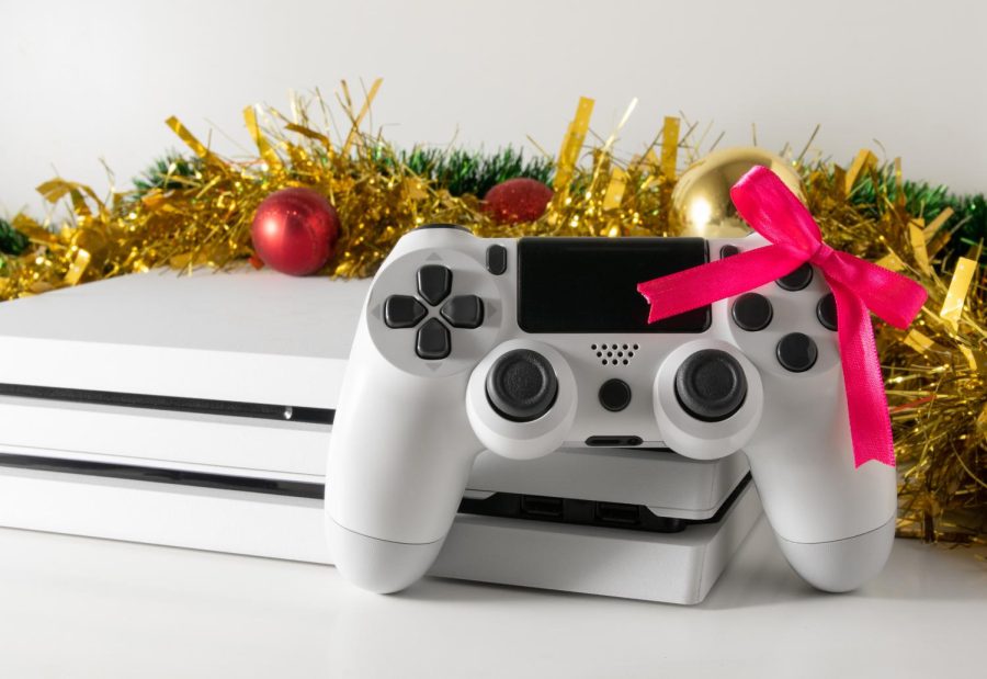 Video game console with a christmas bow on it