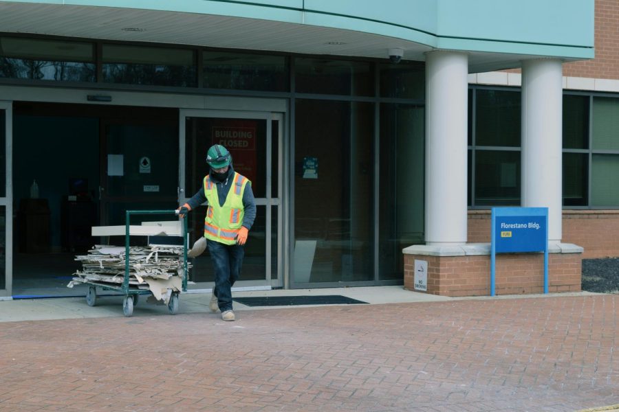 Construction worker moves debris