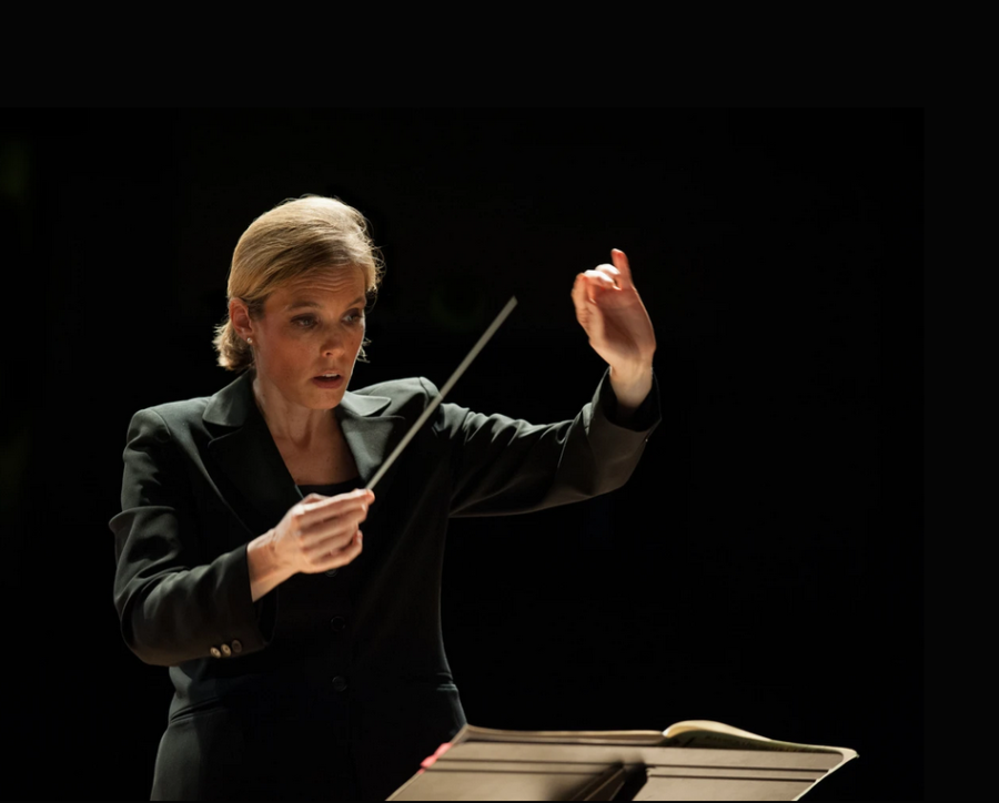 AACC performing arts professors work off-campus in theater, music and dance. Shown, music professor Anna Binneweg conducting an orchestra.