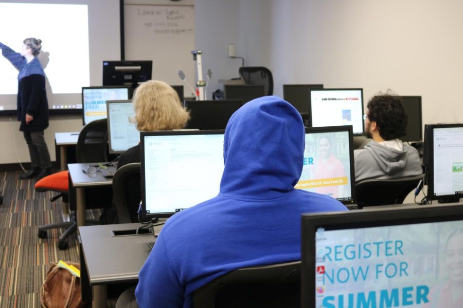 Librarian Sophie Reverdy, left, teaches students and staff to edit Wikipedia articles at an event on Wednesday. 