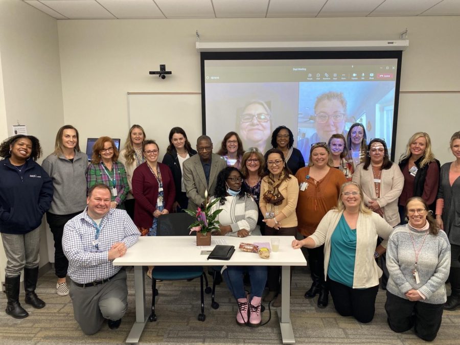 Nursing students have advisers who focus on their mental health and proactively check up on them throughout the semester. Shown, AACC nursing staff pose for a group photo.