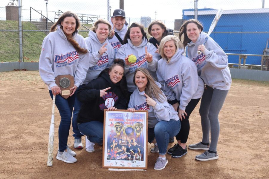 Teammates of AACC's 2003 softball team pose for a photo 20 years after winning the national championship.