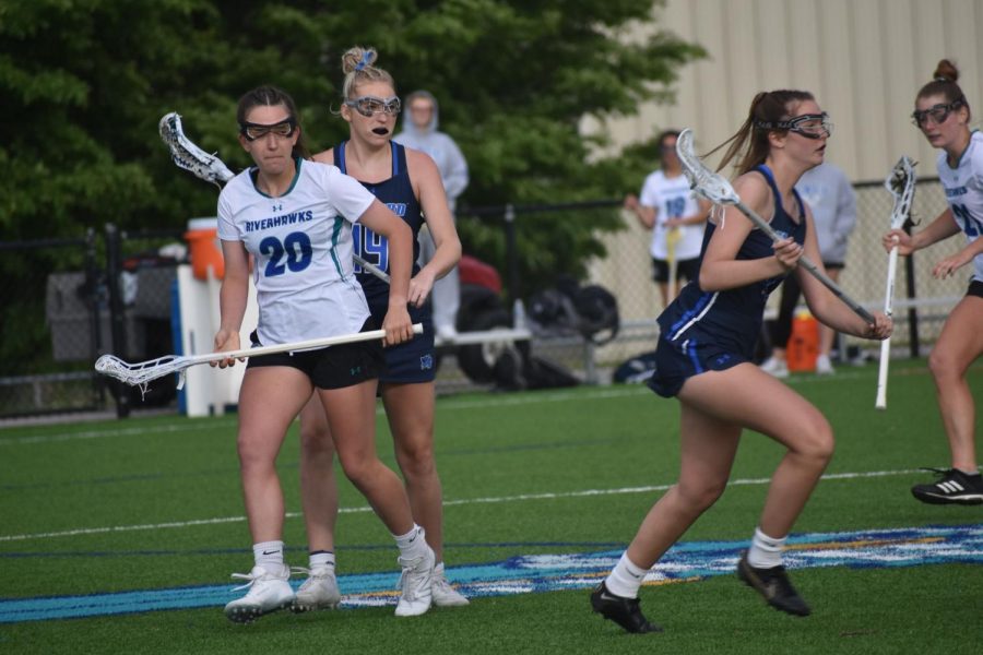 The Riverhawks womens lacrosse team finished its regular season undefeated for the first time since 2007. Shown, No. 20, midfielder Savanna Reitz.