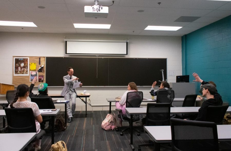 Professor Timothy May teaches an English class. 
