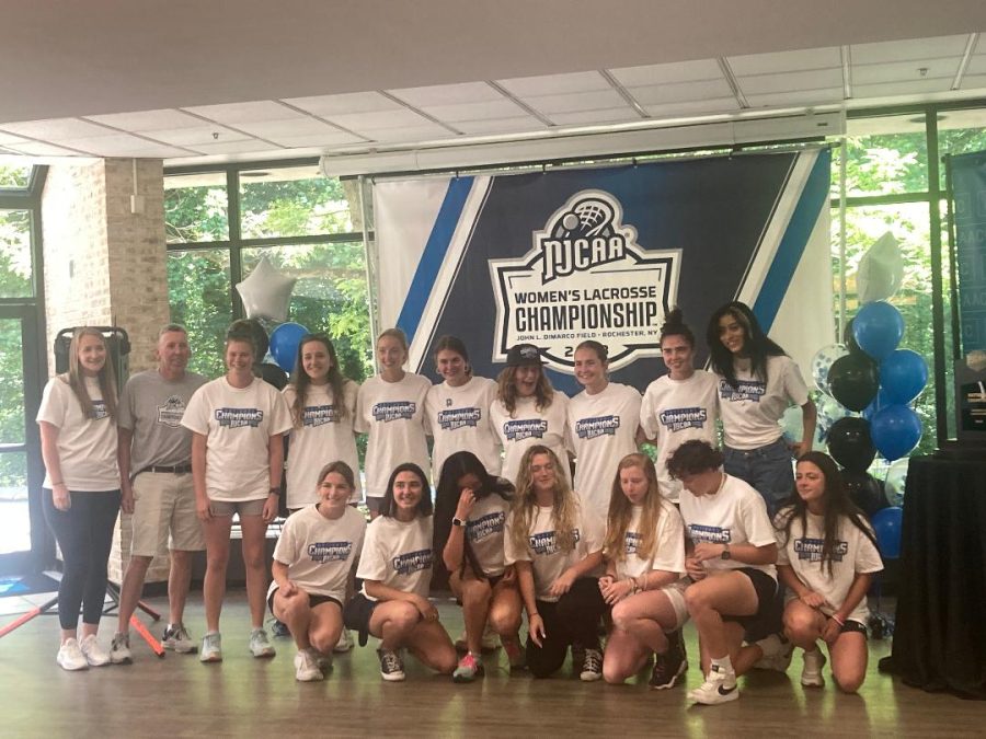 The Riverhawks’ women’s lacrosse team celebrate their national championship win at an event on Wednesday. 