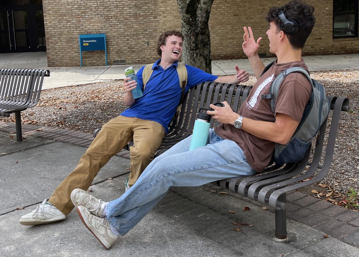 Henry Robbins, left, and Kyle Sheppard talk and laugh in the quad after their summer class.