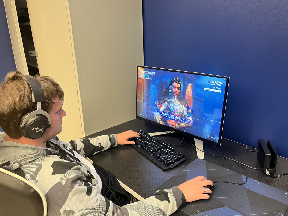 Transfer studies student Zach Schwartz, who plays for AACC's esports team, practices his gaming skills in the esports lab. 