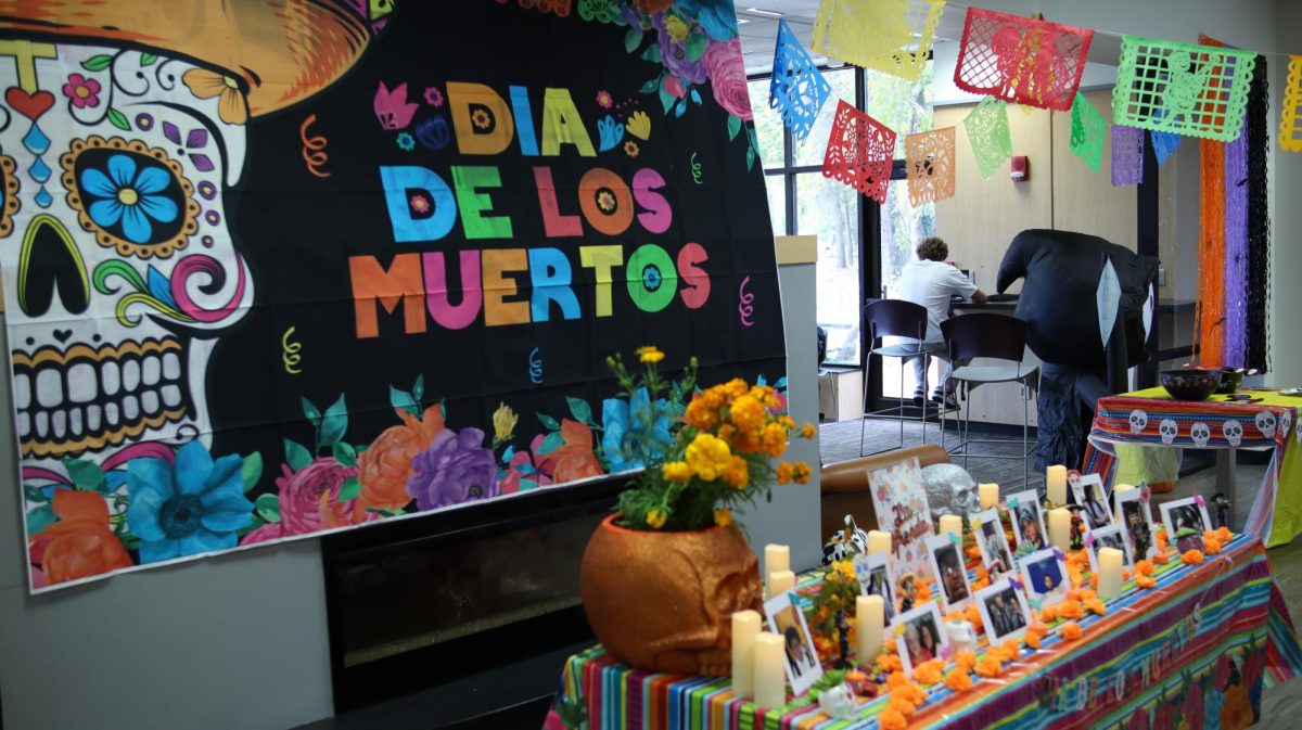 Students celebrate Dia de los Muertos and Halloween at the Hallows Fiesta event on Monday.