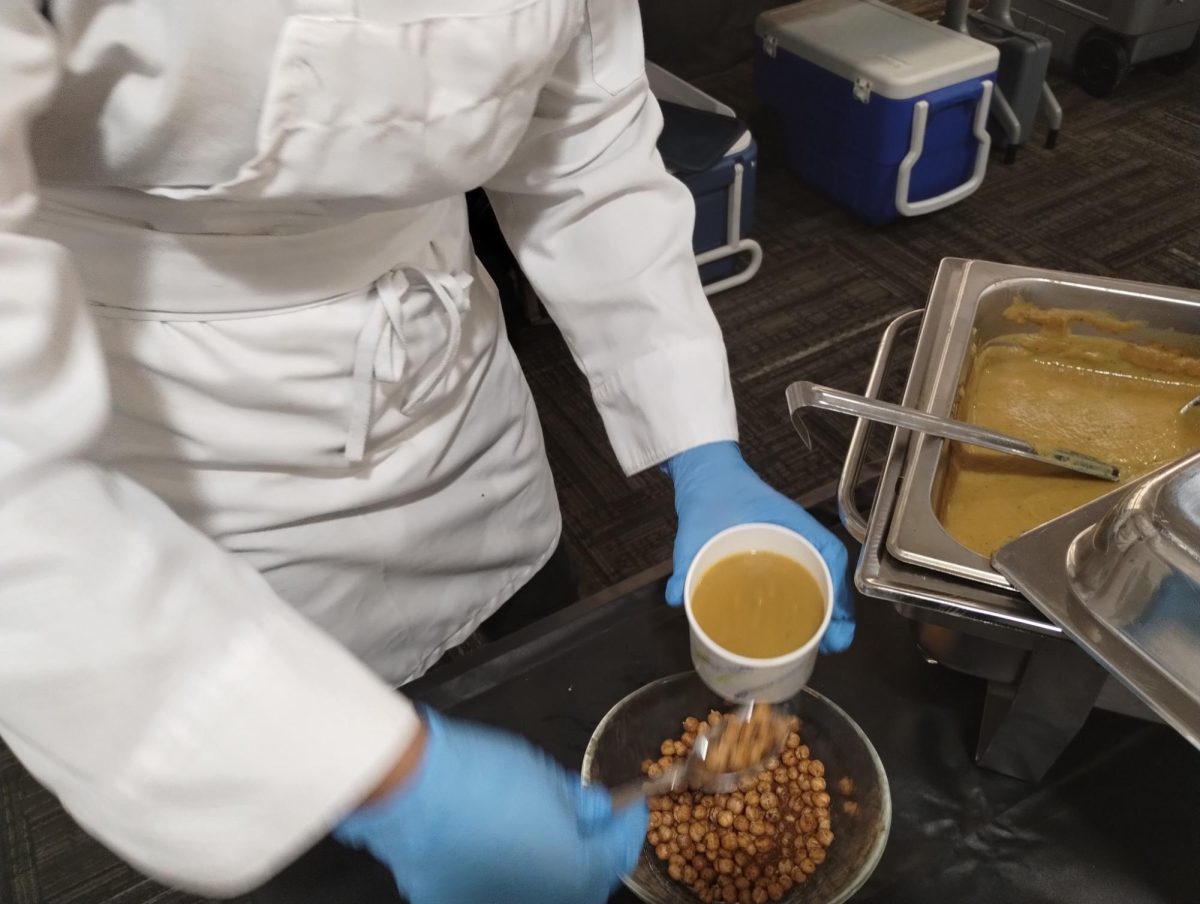 Culinary students prepare soup, bread rolls and chili to serve at an Empty Bowls charity fundraising event.