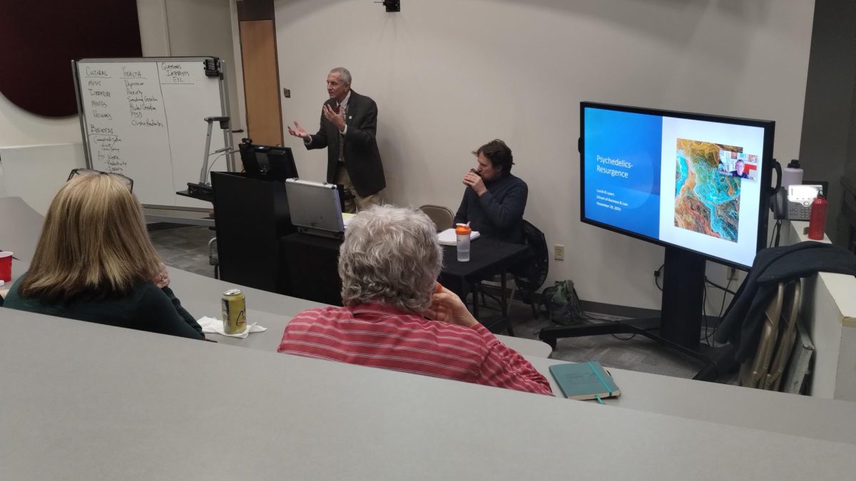 Professor Shad Ewart speaks to students about psychedelics at an open discussion. 