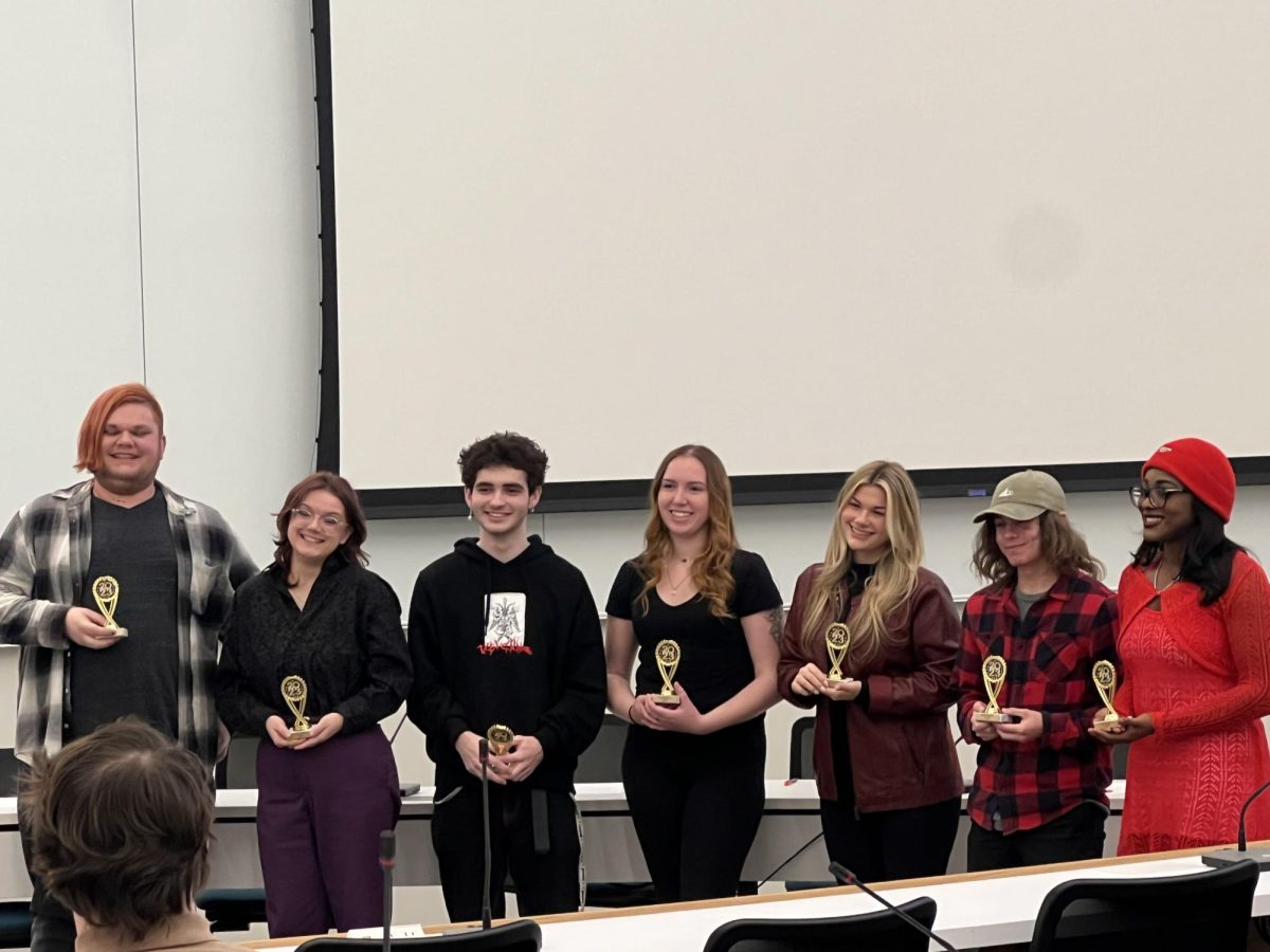 The winning team of the Bioethics Bowl Tournament receive awards.