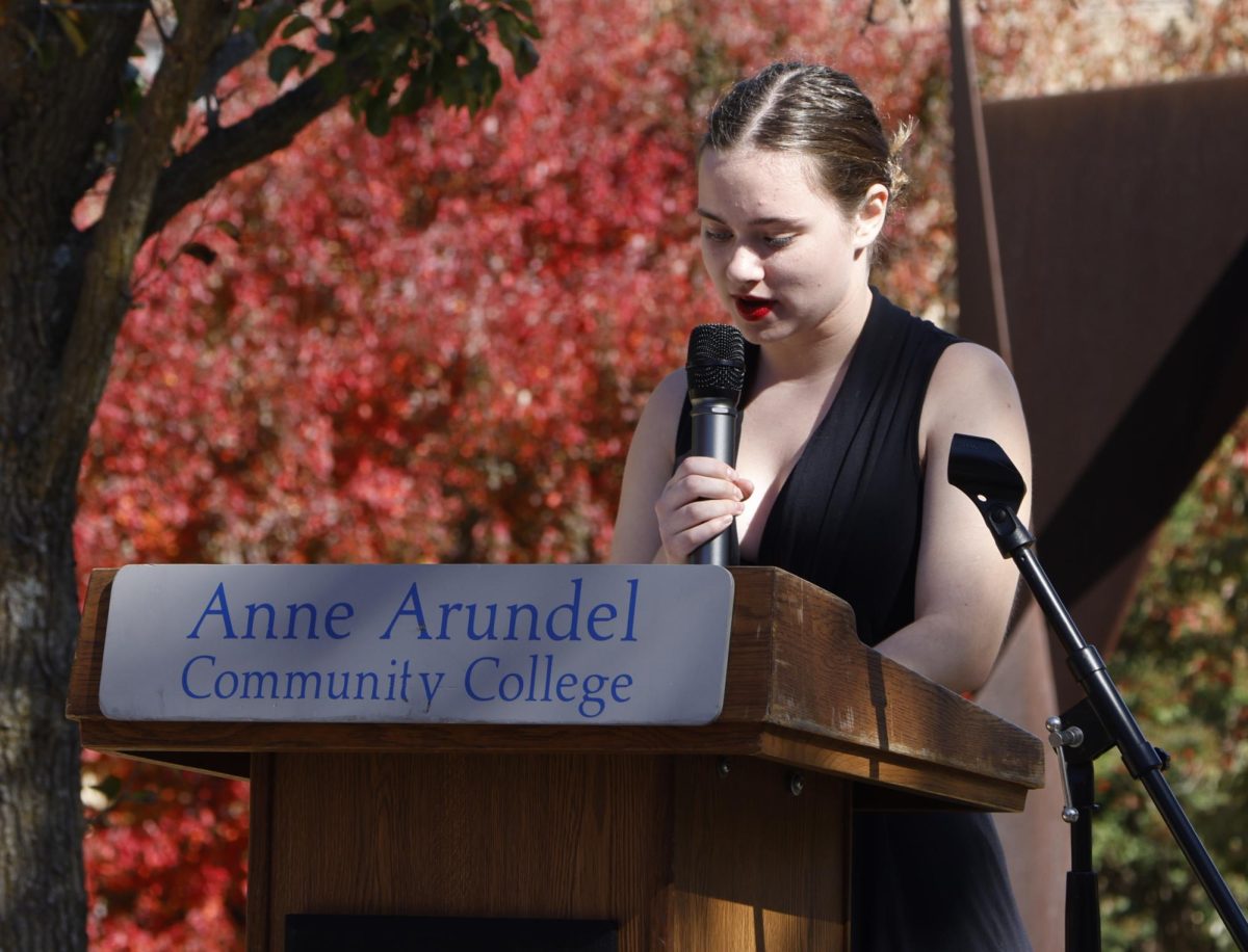 Campus Current Co-Editor Izzy Chase discovered her love of public speaking by giving a eulogy at her grandfather’s funeral. Shown, Chase speaks at the Civility Matters event on the Quad in October.