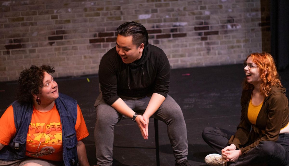 Improv club members Dax Goetia, left, Michael Dang and Éva Parry prepare for the club’s February performance at the Black Box Series productions.