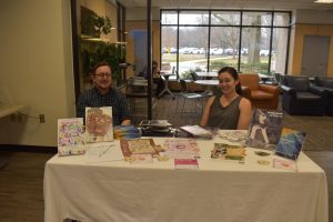 Simon Ward, left, and Sierra Luers represent Amaranth, AACCs student journal for the arts, at the campus Involvement Fair event.