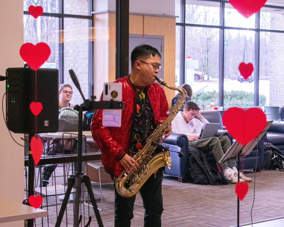 Student volunteer Kyle Neis plays the saxophone at the Swoops Sweethearts Valentines Day event, hosted by the Student Government Association, on Tuesday