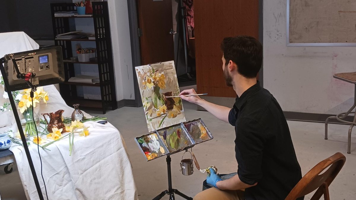 Award-winning artist Jared Brady painted live for AACC students.